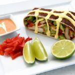 Savor the Grilled Chicken Avocado Wrap at Oasis Pool Bar
