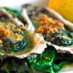 Savor Grilled Oysters Rockefeller with Spinach & Cheese Flair